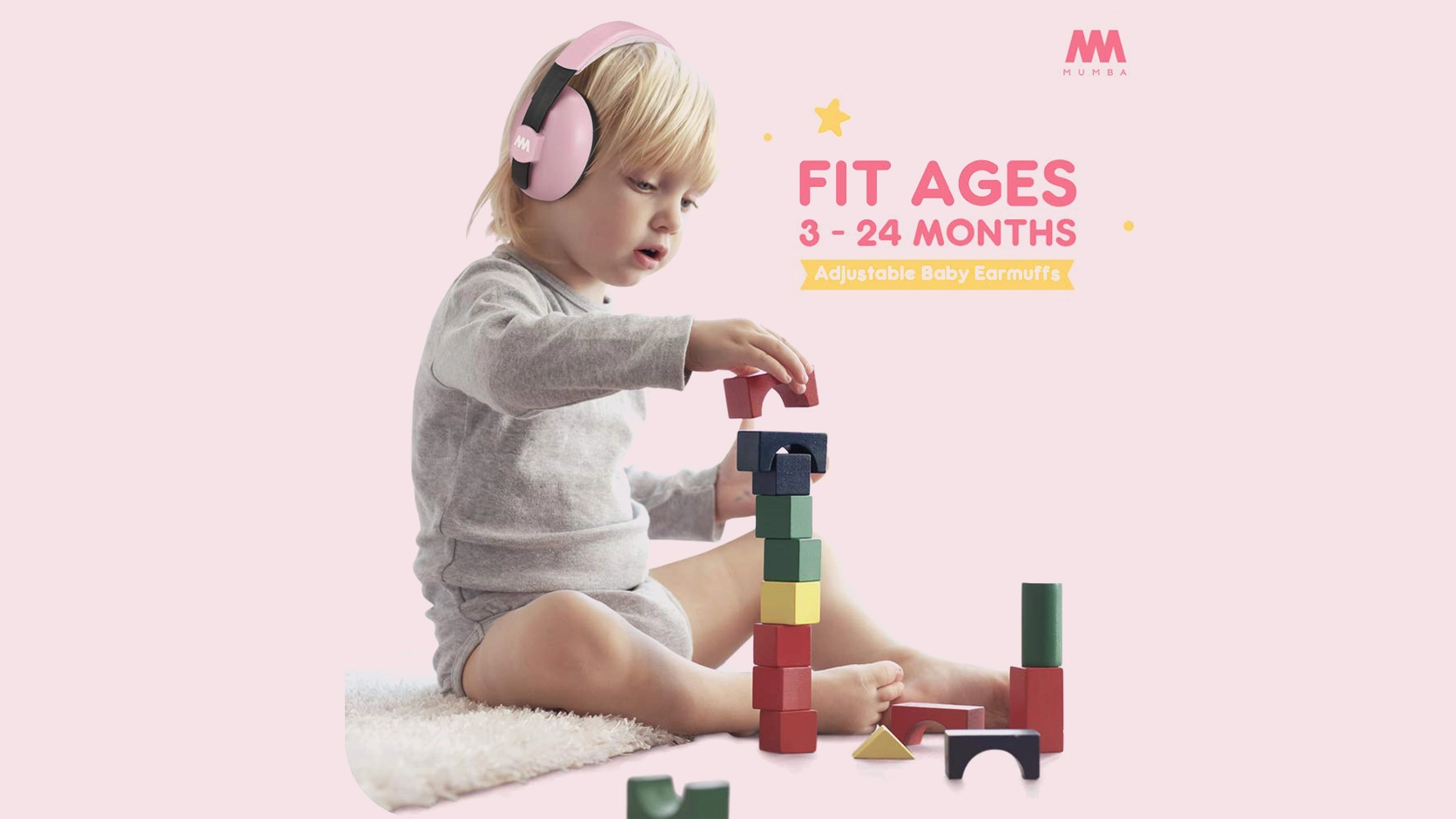 Baby wearing Mumba noise reduction earmuffs during flight
